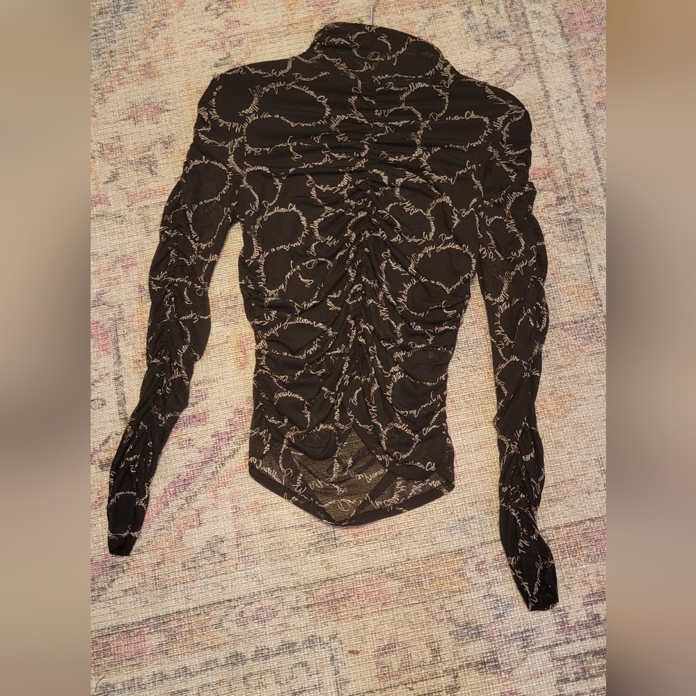Black and White Ruched Mesh Long Sleeve Top With Cursive Graffiti Writing.